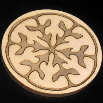 Seed pod coaster - walnut inlay in basswood